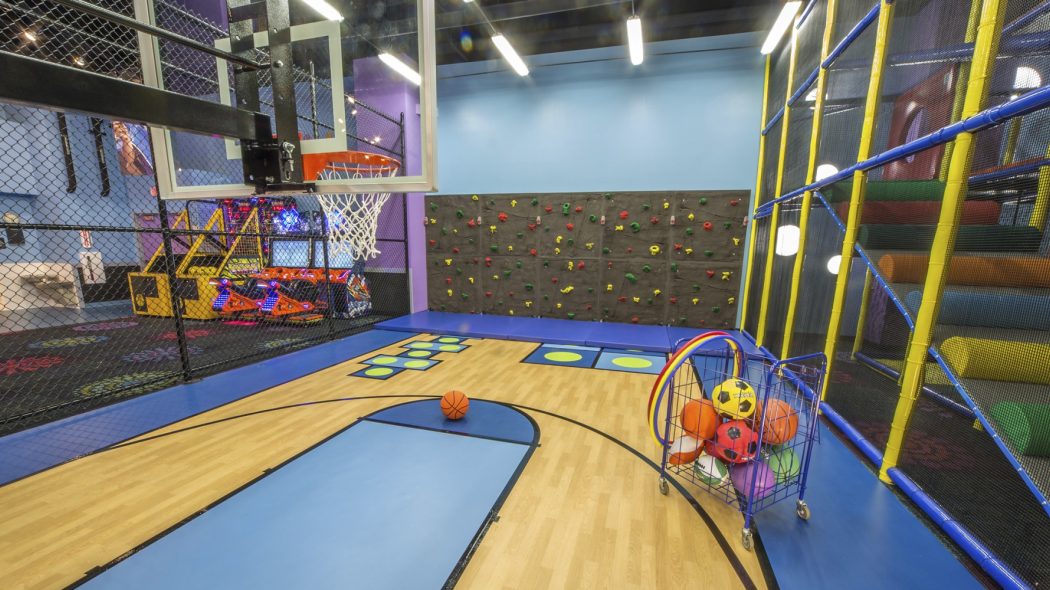 Indoor basketball court and climbing wall inside Kids Quest at Northern Quest.